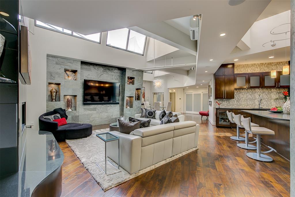 a living room with fireplace furniture and a flat screen tv