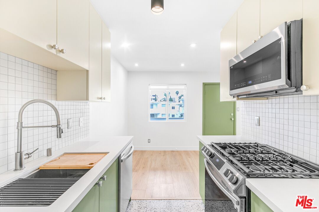 a kitchen with a stove and a microwave