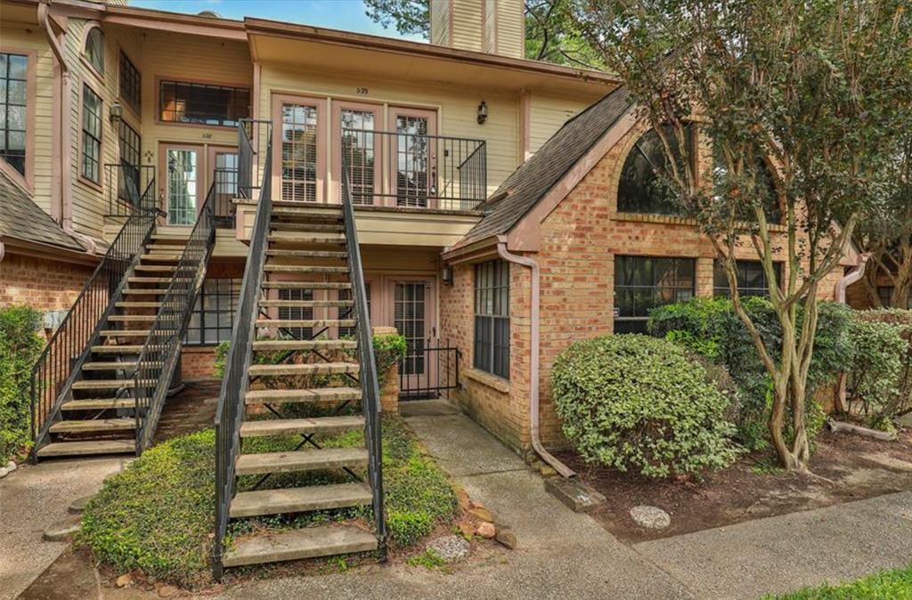 a front view of a house with stairs