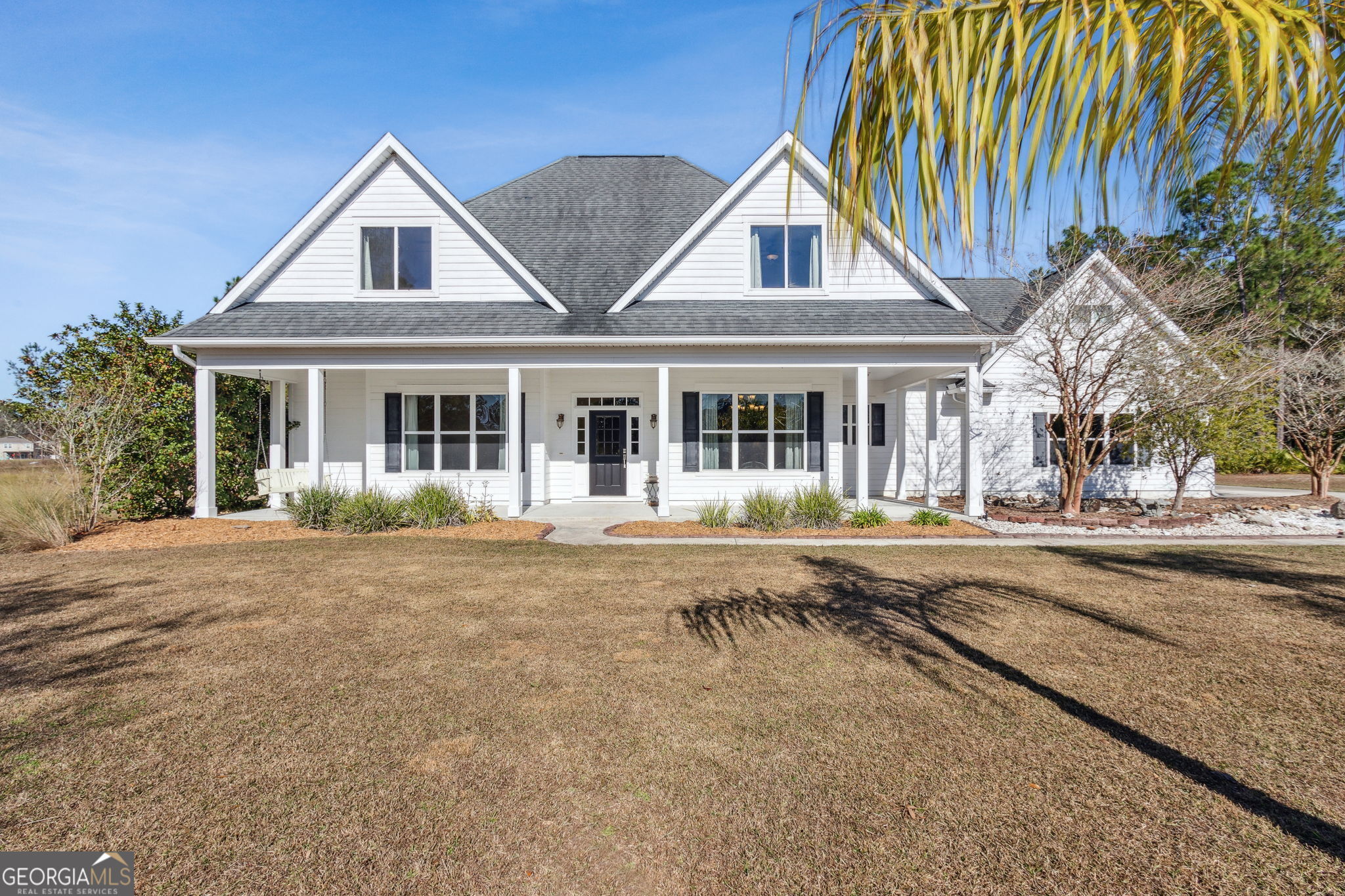 front view of a house with a yard