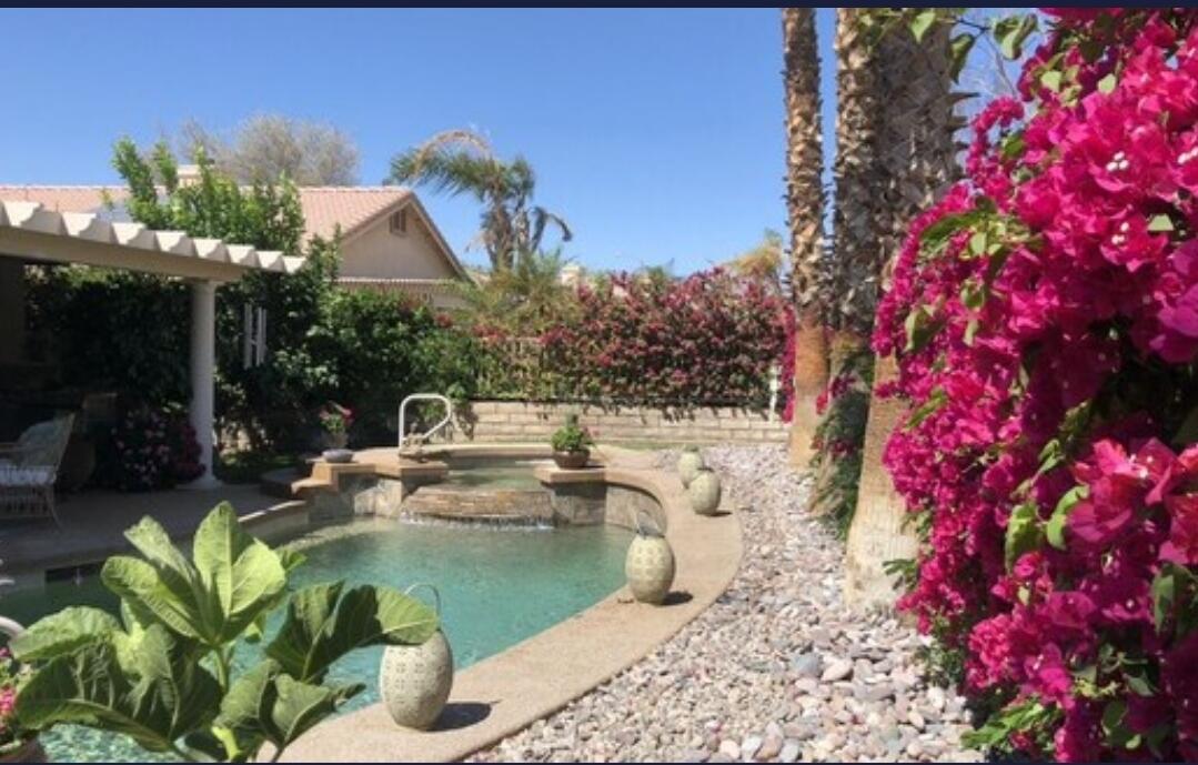 a view of a swimming pool with a patio