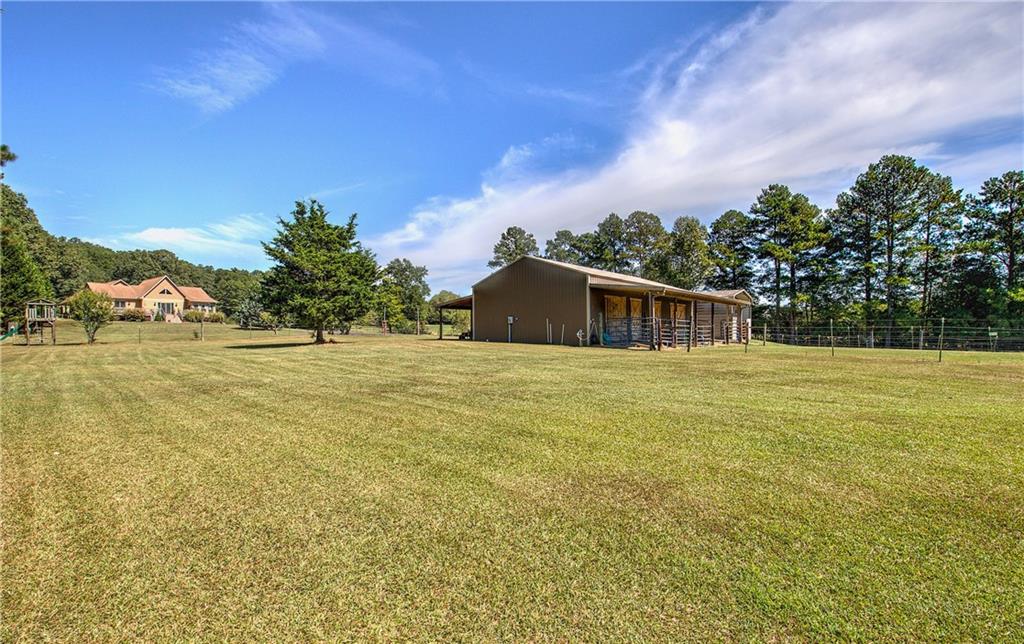 a house view with swimming pool in front of it