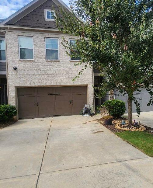 a front view of a house with yard