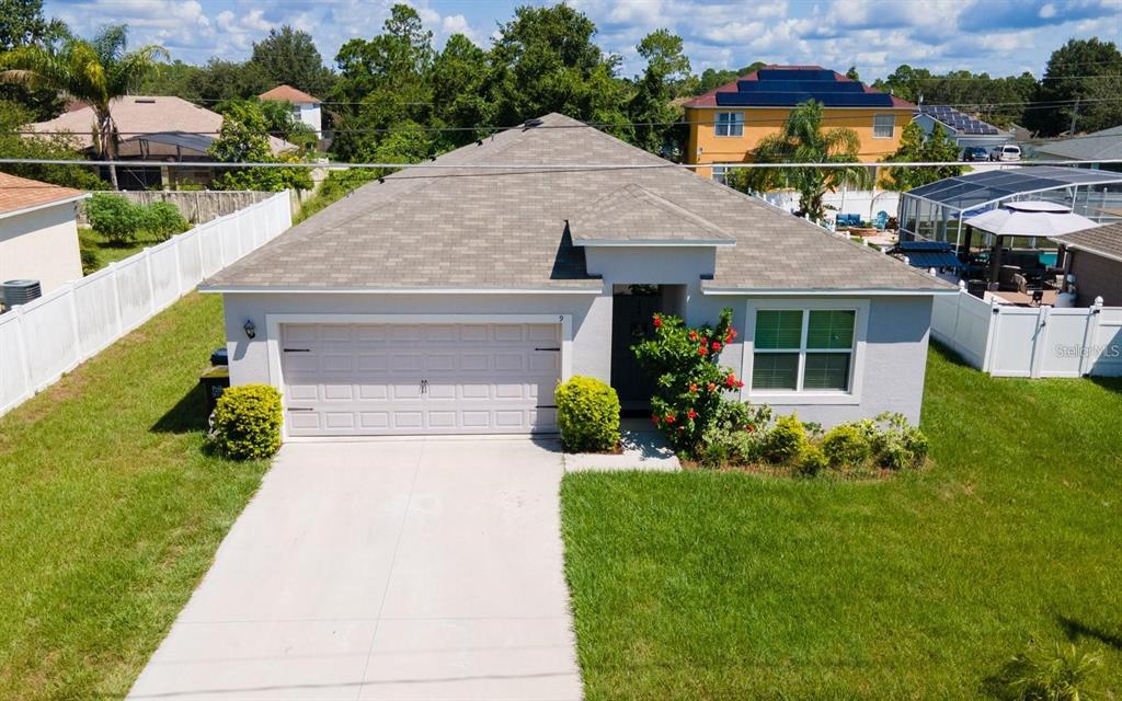 a aerial view of a house with garden