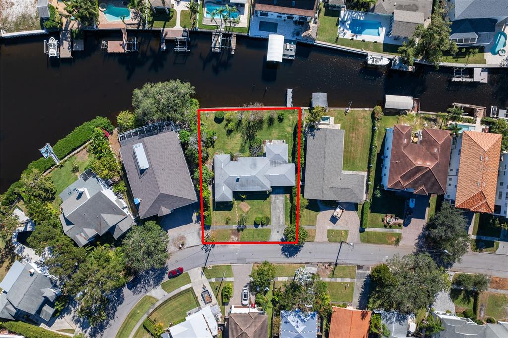 an aerial view of houses with outdoor space