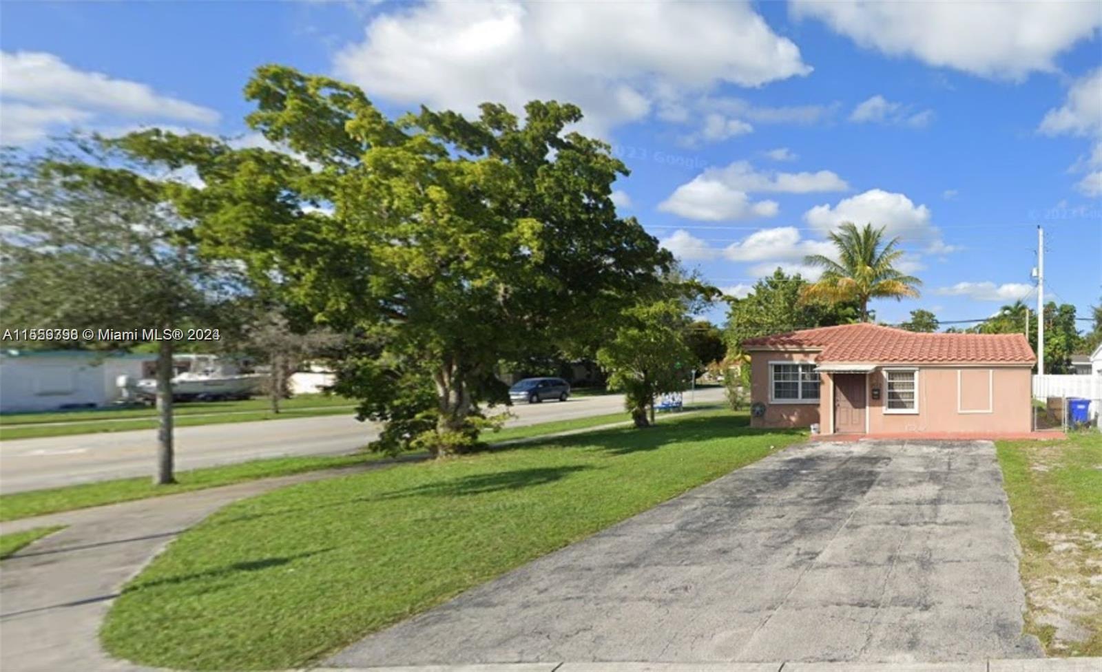 a view of a house with a big yard