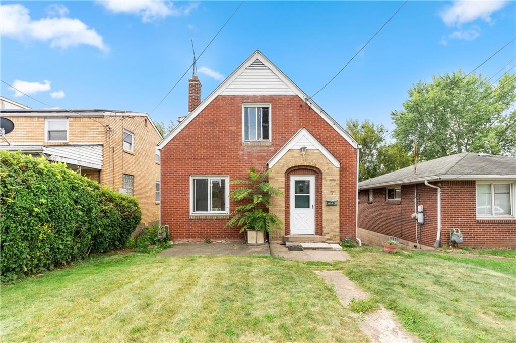 a front view of a house with a yard