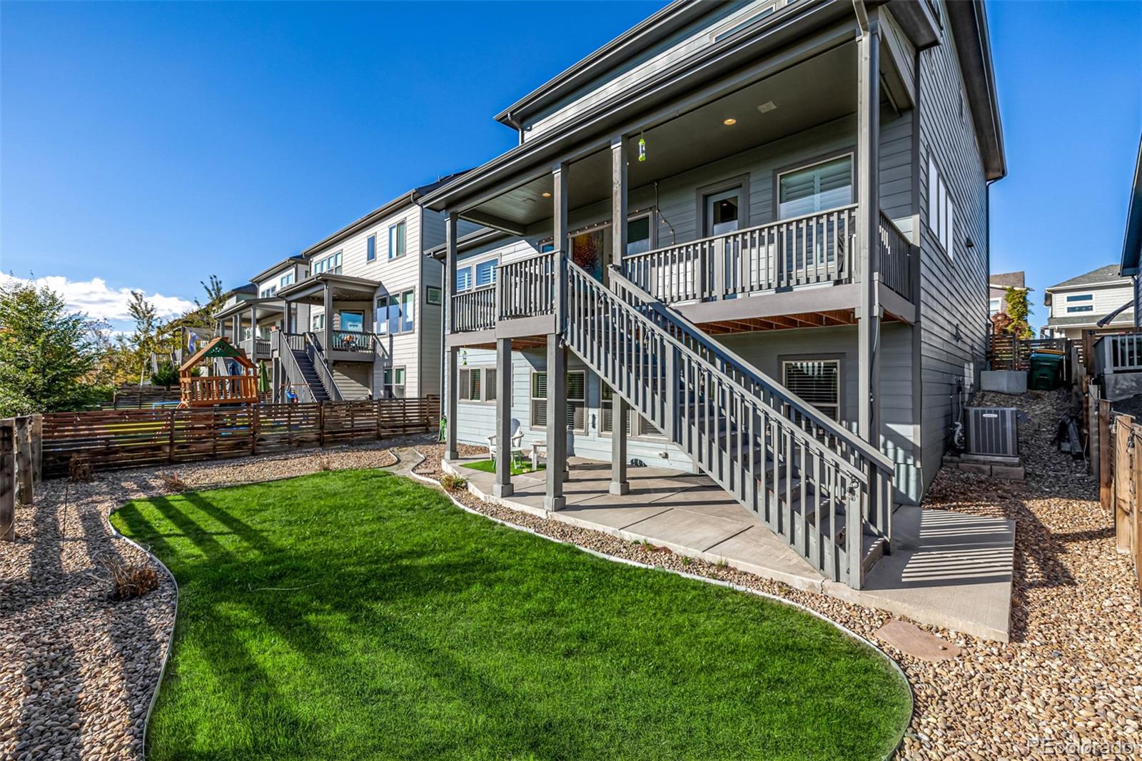 a view of house with backyard and patio