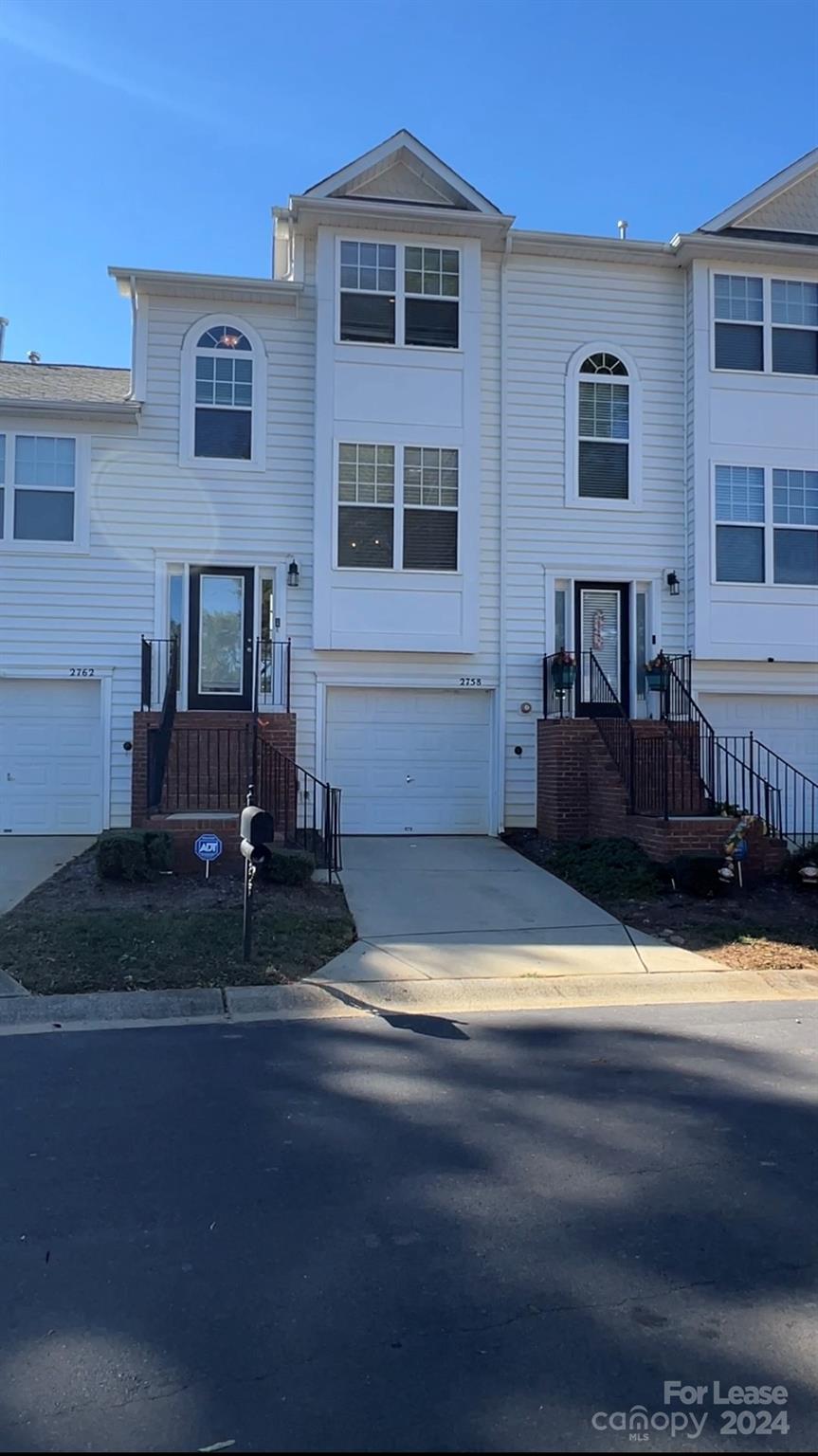 a front view of a house with yard