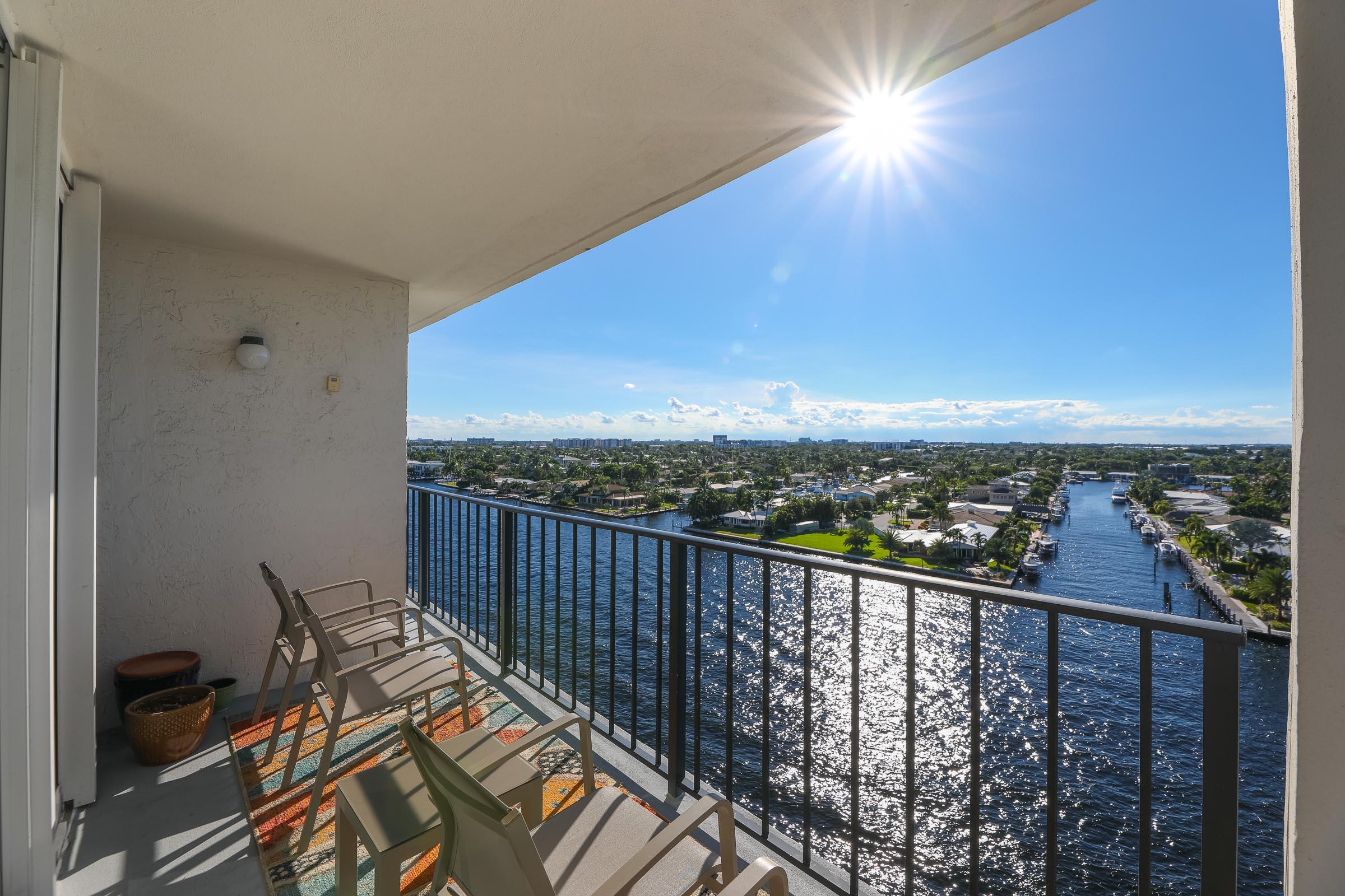 a view of a balcony with furniture