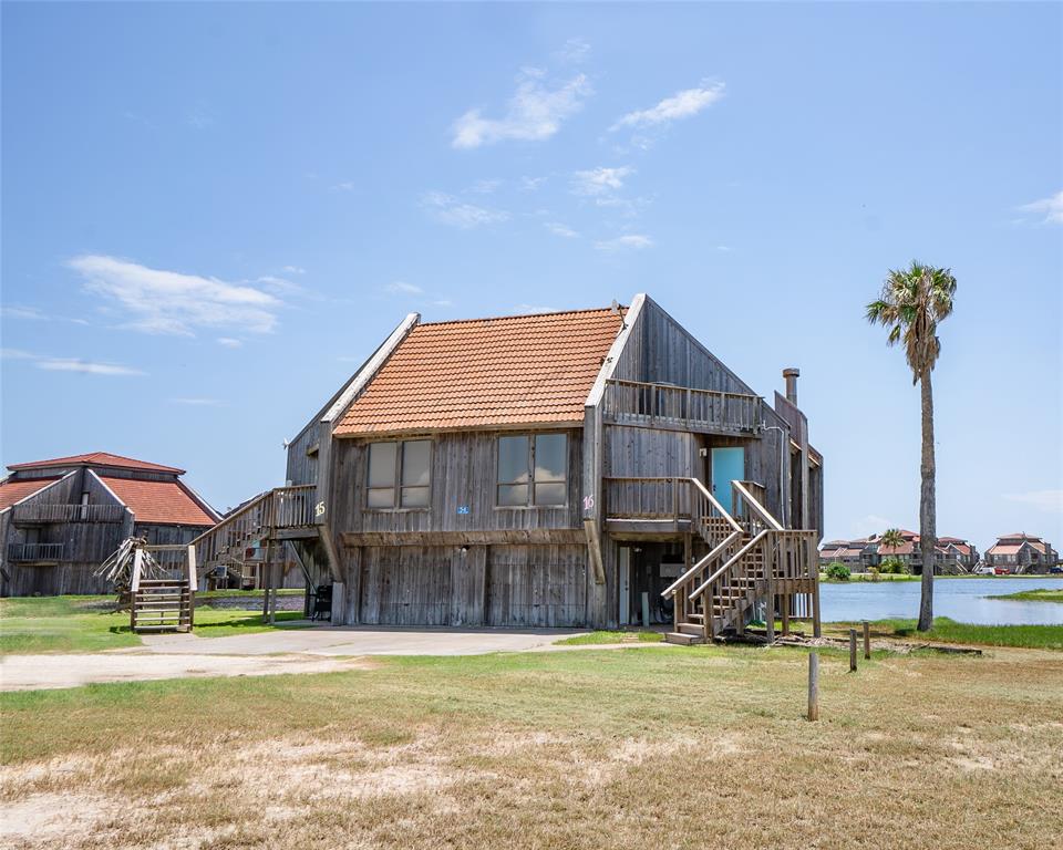 a view of a house next to a big yard