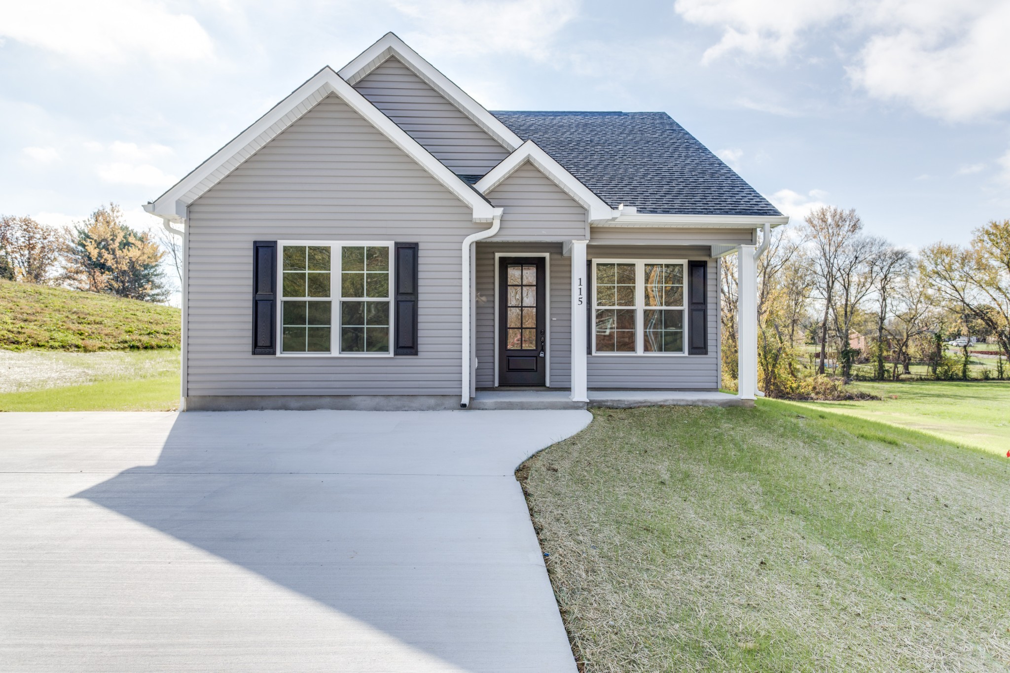 front view of a house with a yard