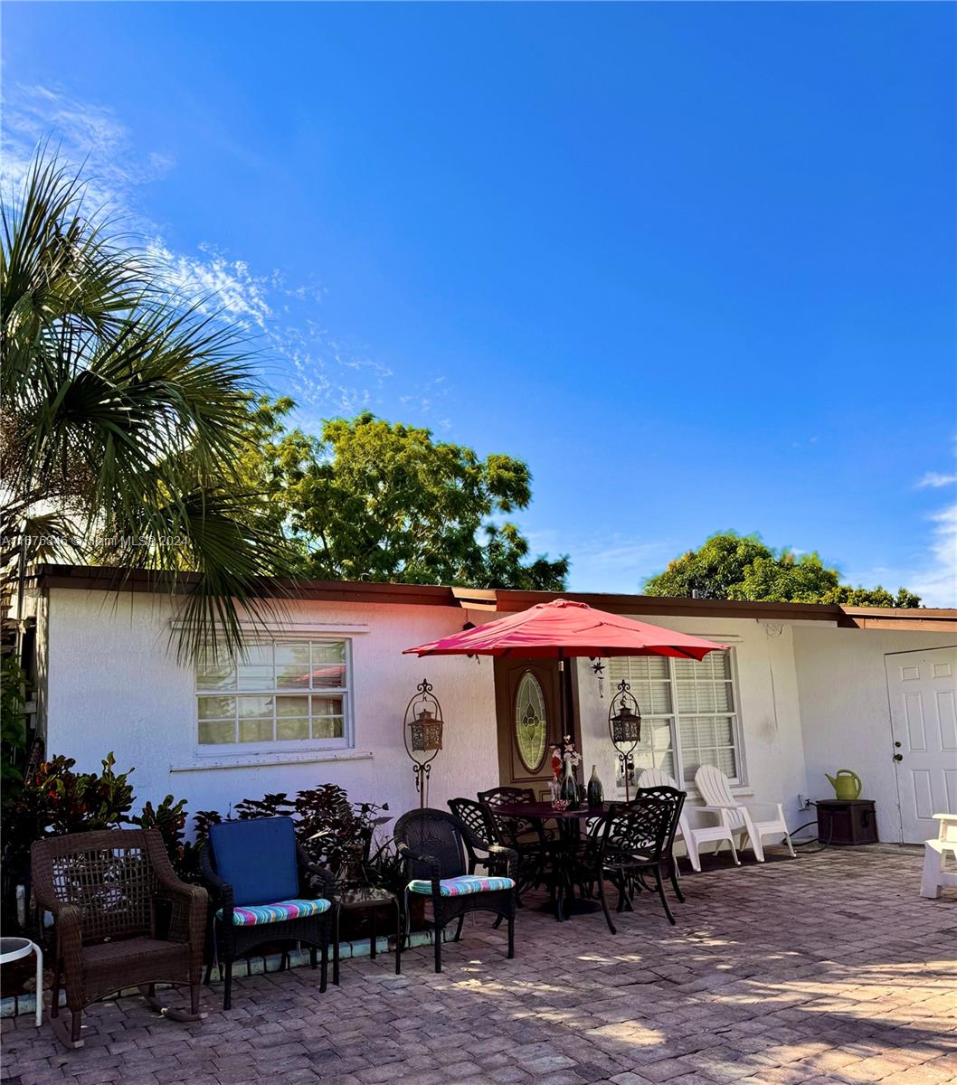 a front view of a house with patio