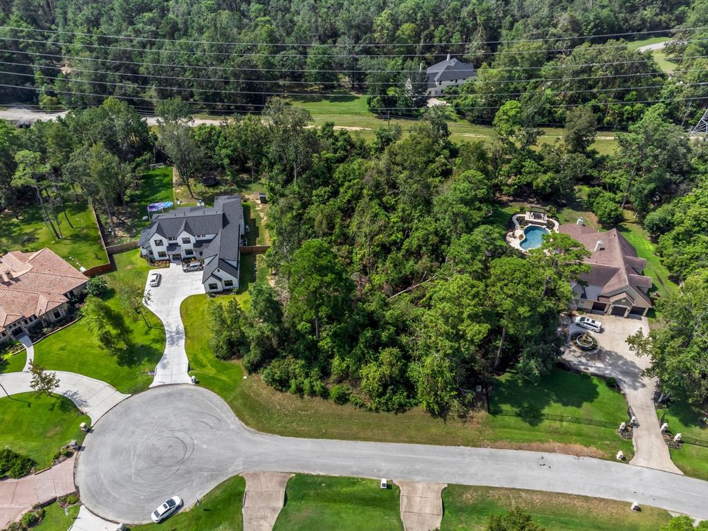 an aerial view of a house with yard