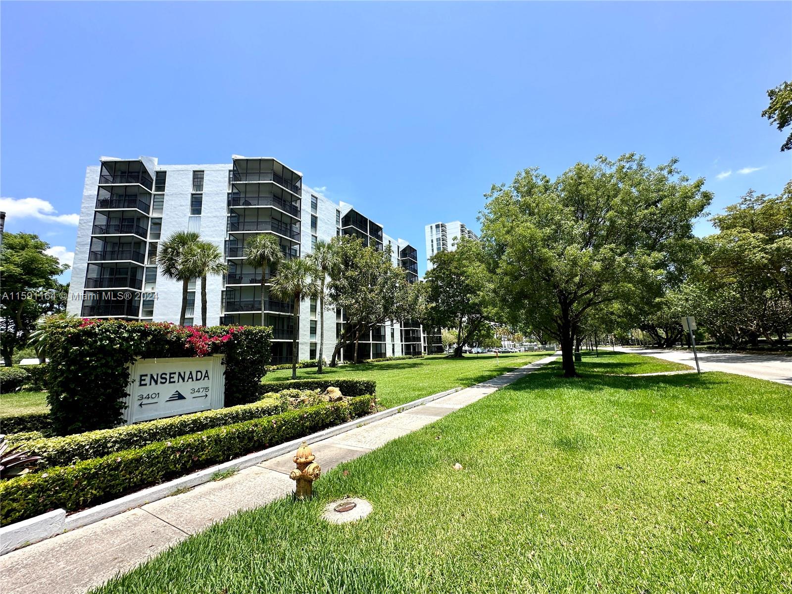 a front view of a building with garden