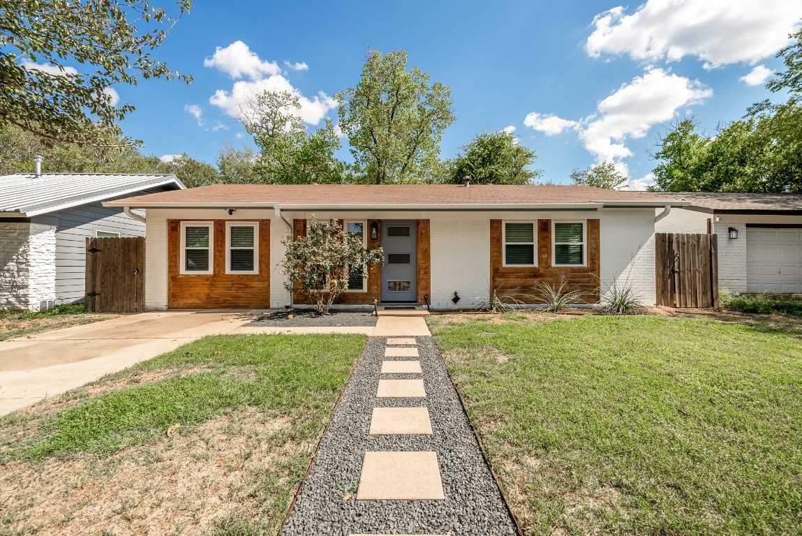 front view of a house with a yard