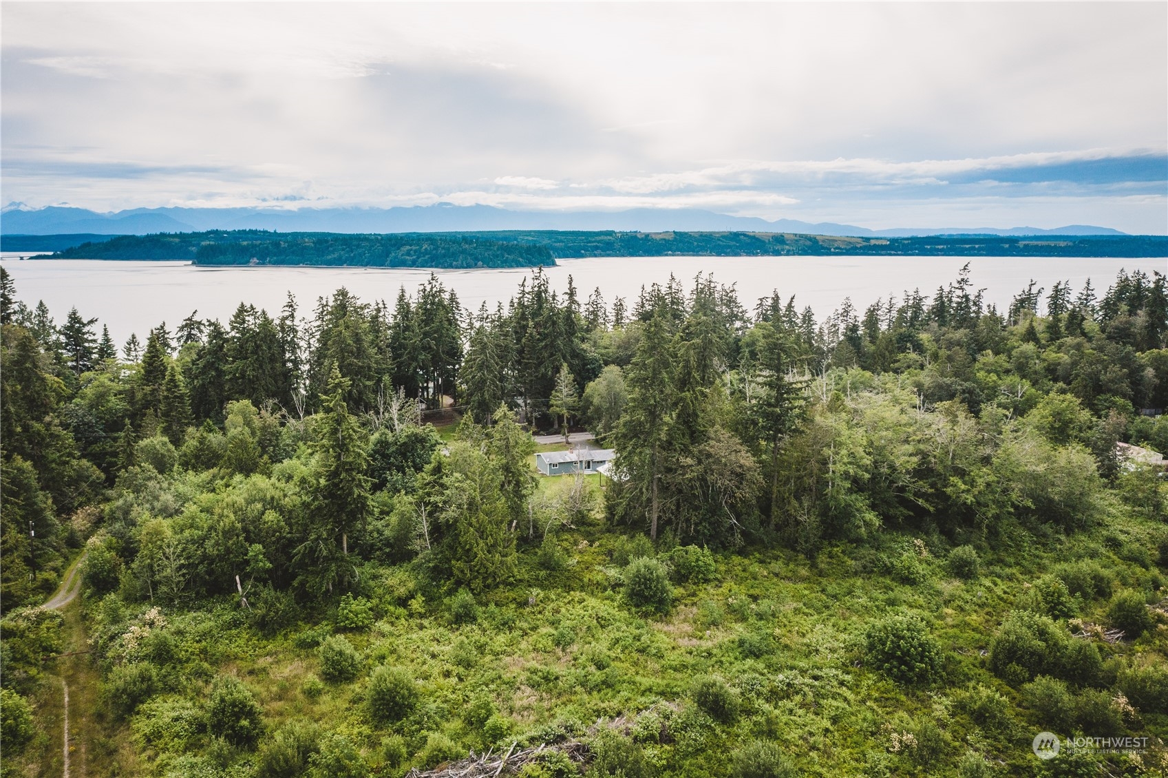 a view of lake and mountain from a yard