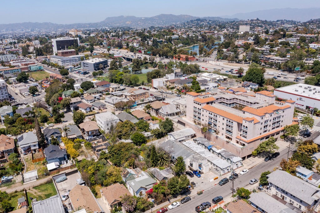 an aerial view of residential houses with city view