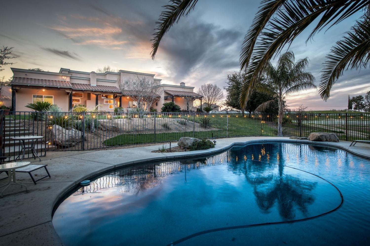 a view of a swimming pool with a patio