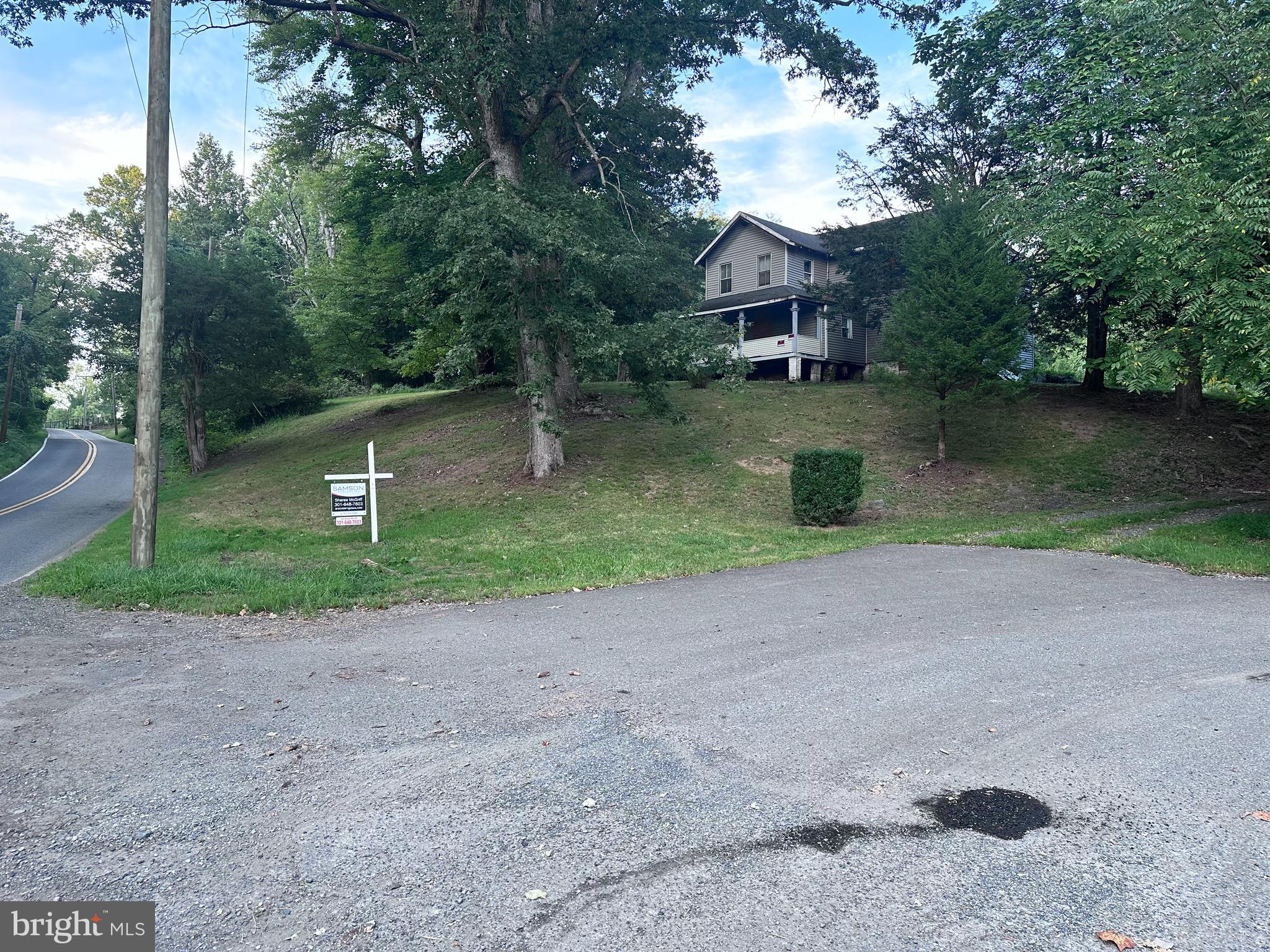 a front view of a house with a yard and a floor