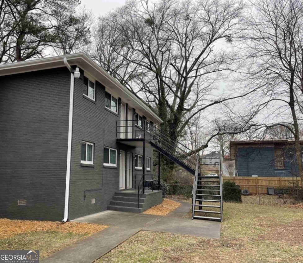 a front view of a house with parking space