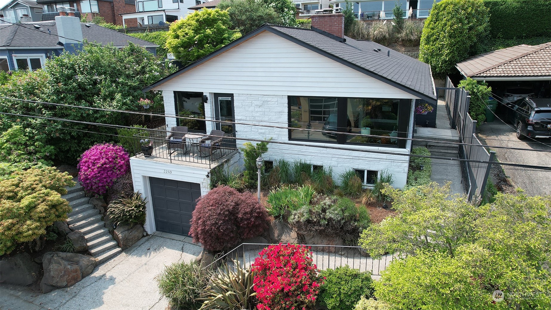 a front view of house with yard and outdoor seating