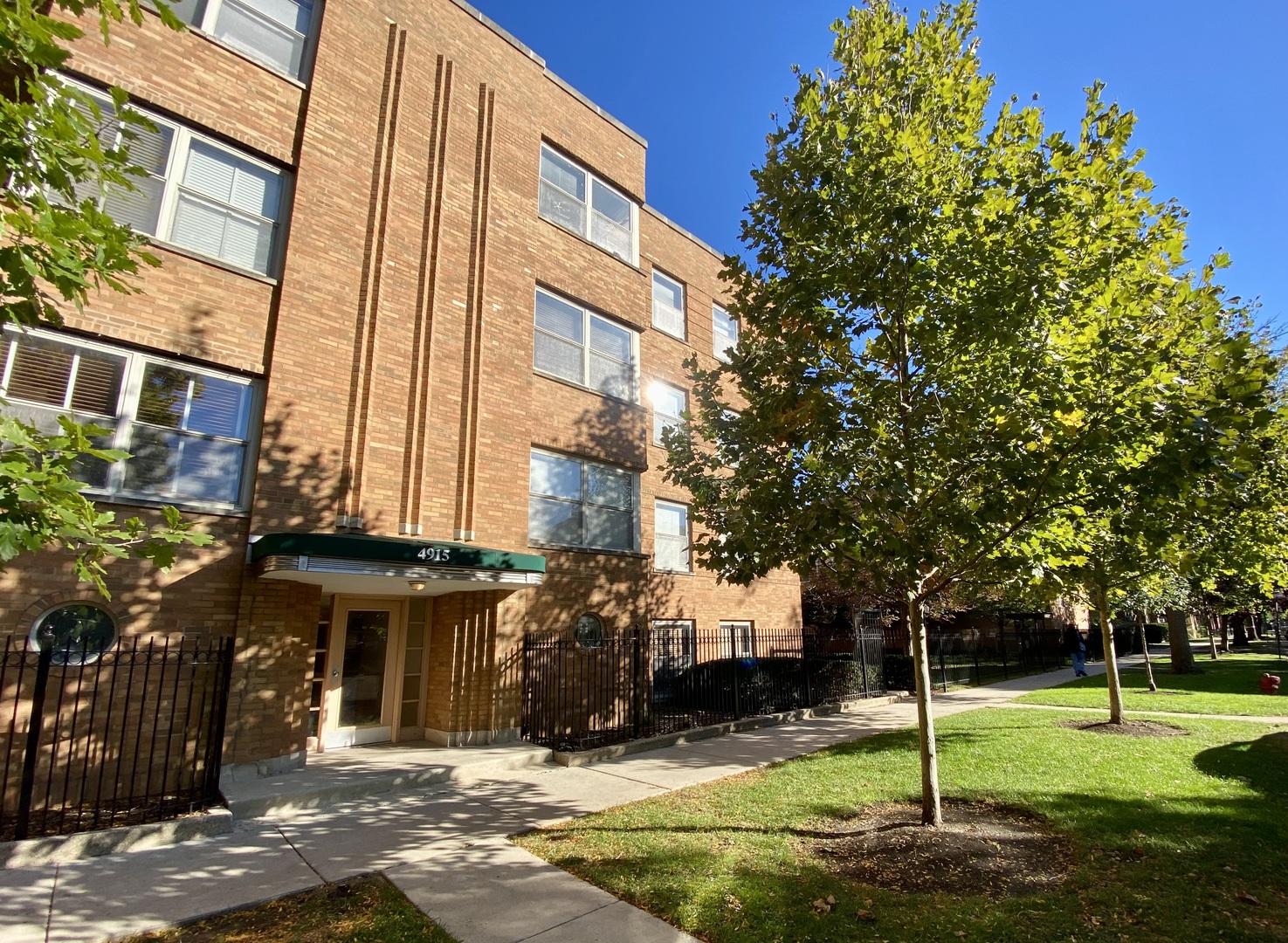 a view of a building with a yard