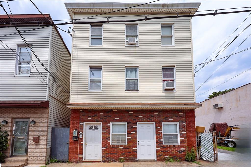 a front view of a house with parking