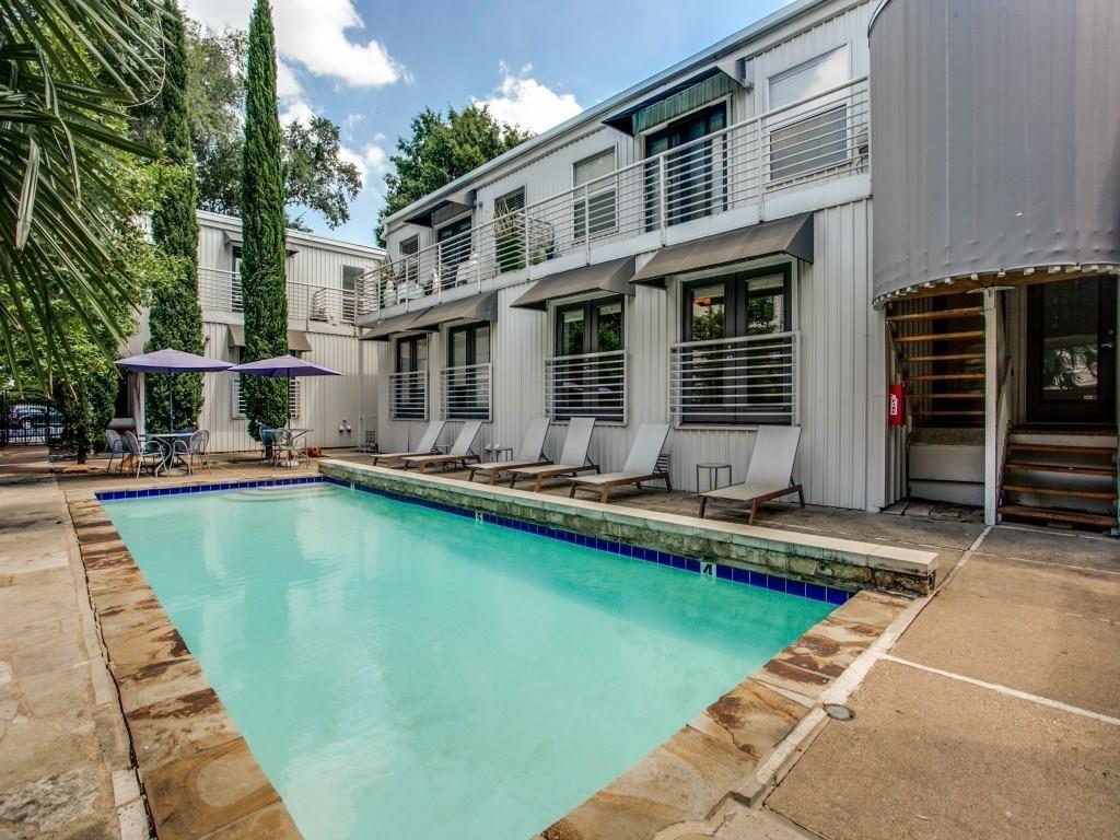 a view of a house with pool on table and chairs