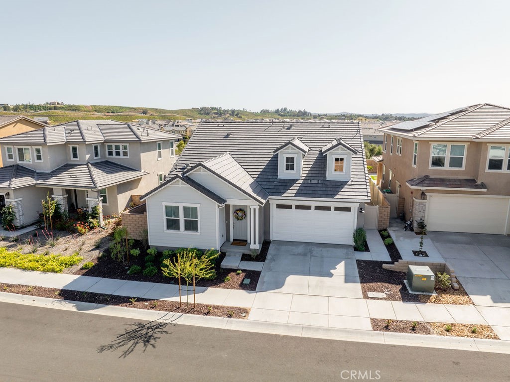 an aerial view of a house with yard swimming pool and outdoor seating