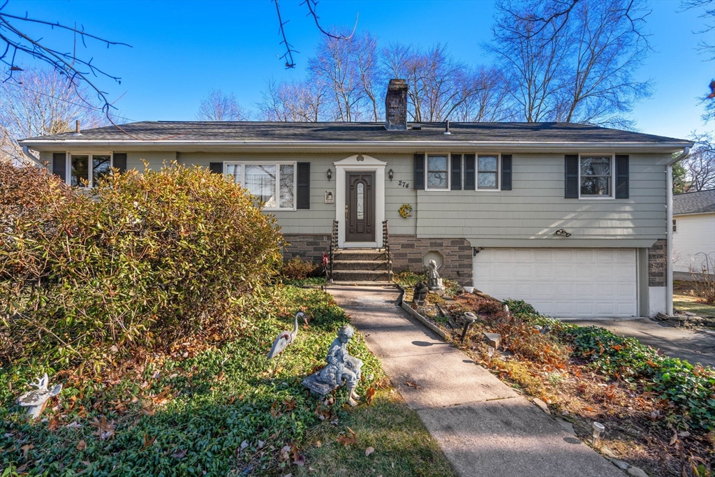 front view of a house with a small yard