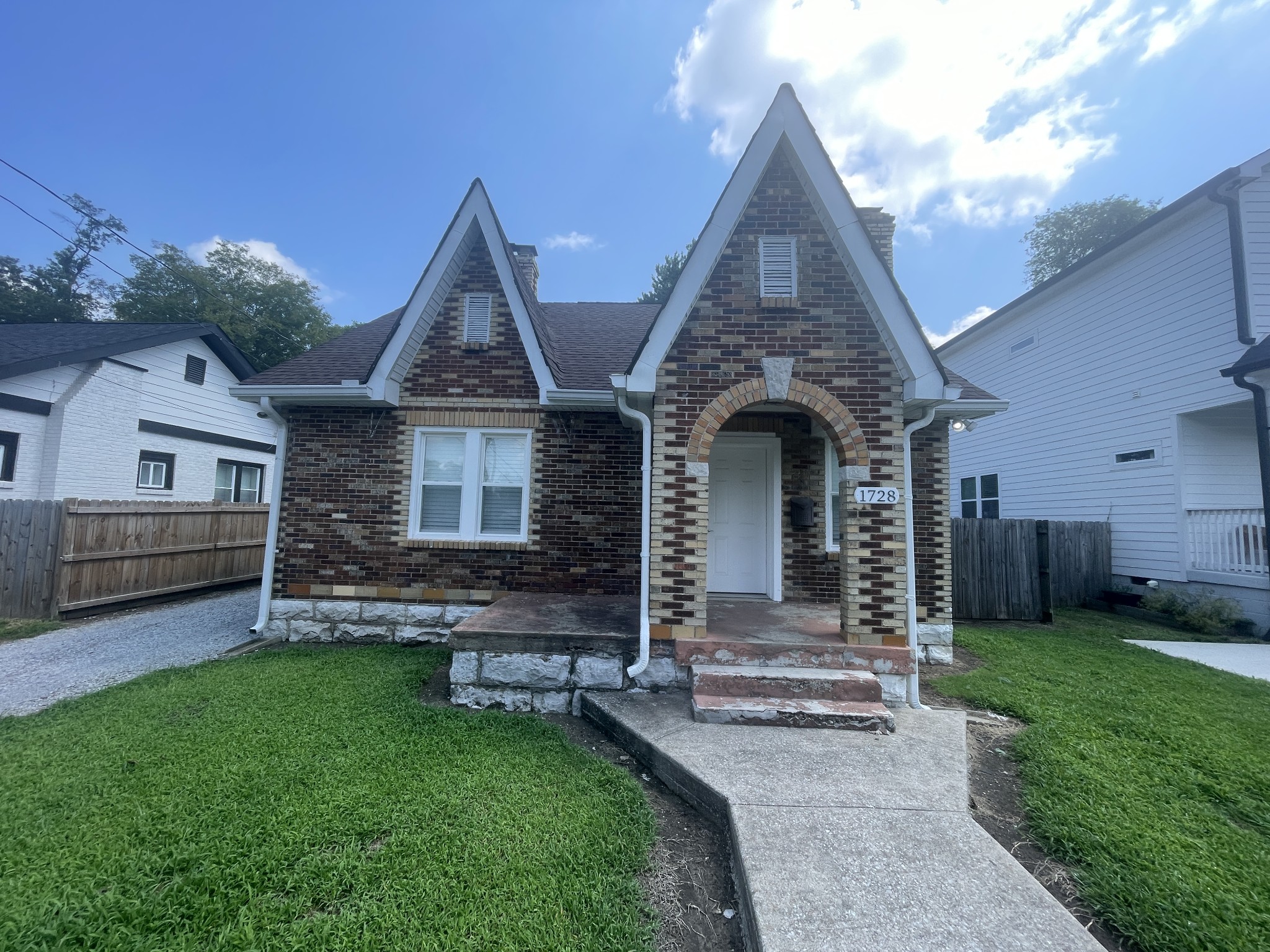 front view of a house with a yard