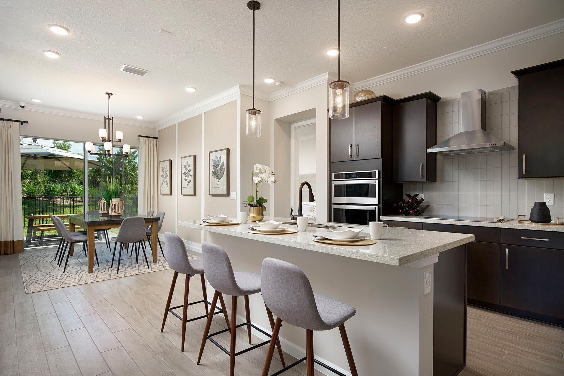 a kitchen with stainless steel appliances kitchen island granite countertop a sink and cabinets