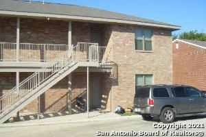 a front view of a house with parking area