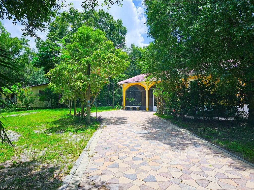 View of community featuring a gazebo and a lawn