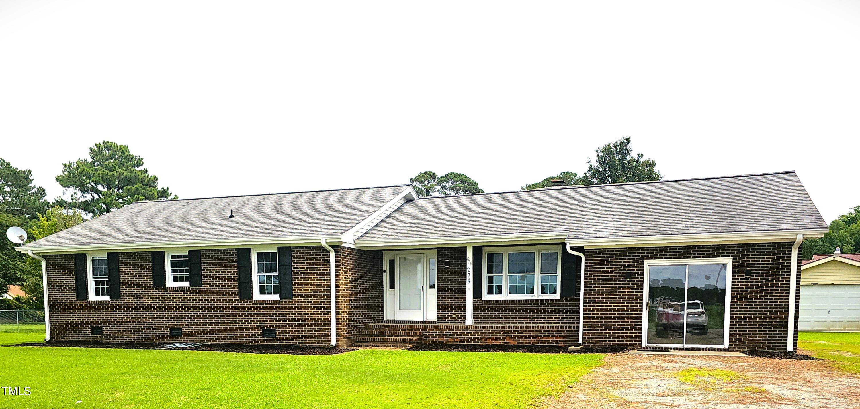 front view of a house with a yard