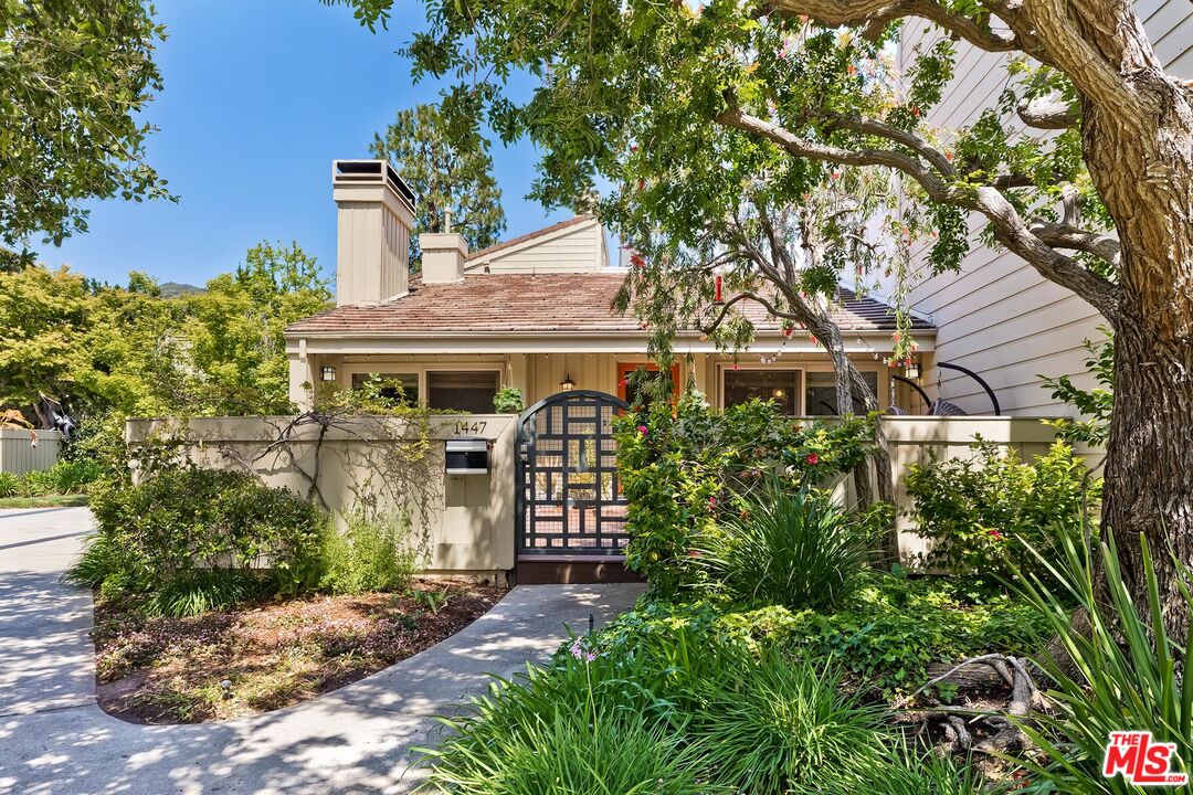 front view of a house with a garden