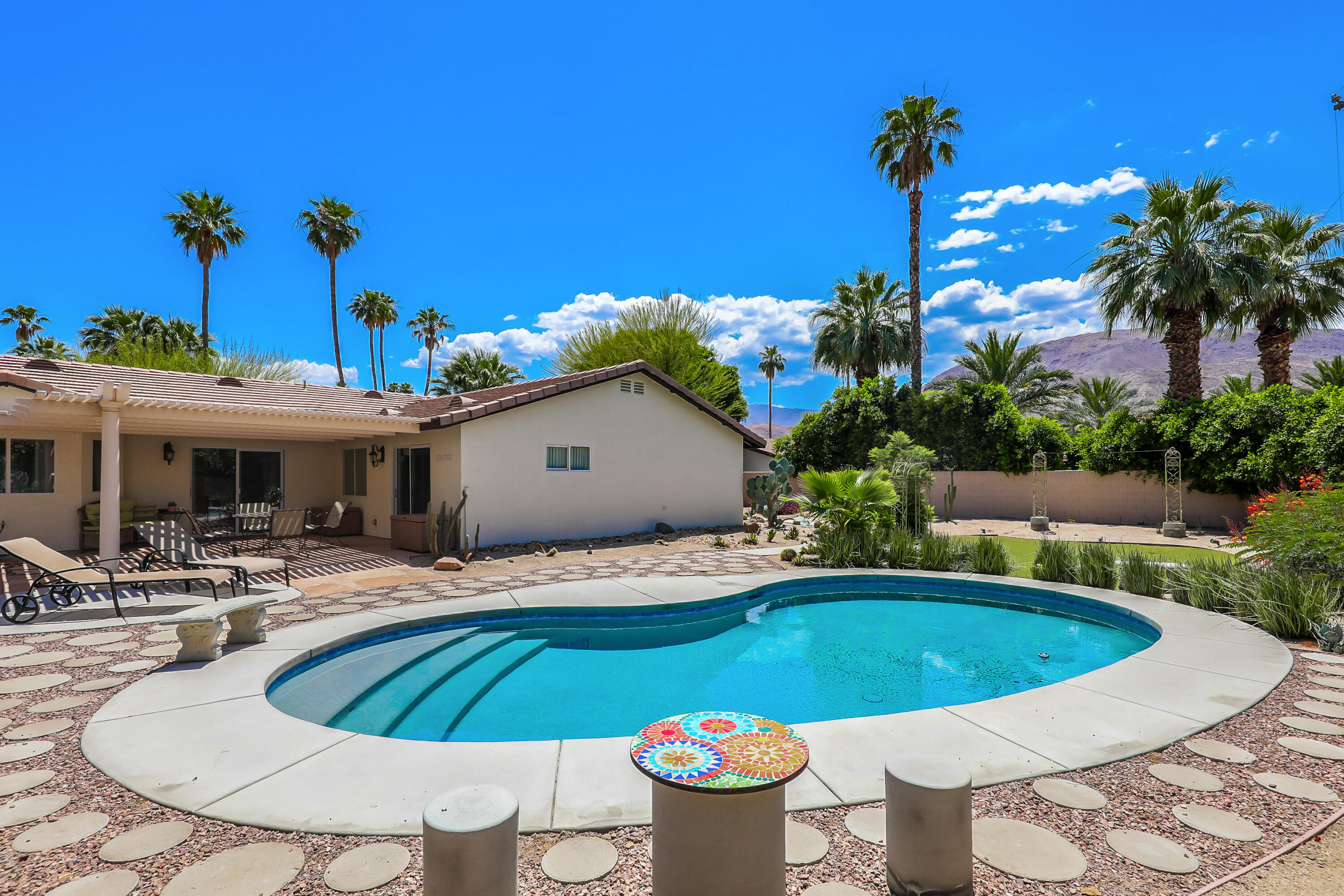 a view of a swimming pool with a patio