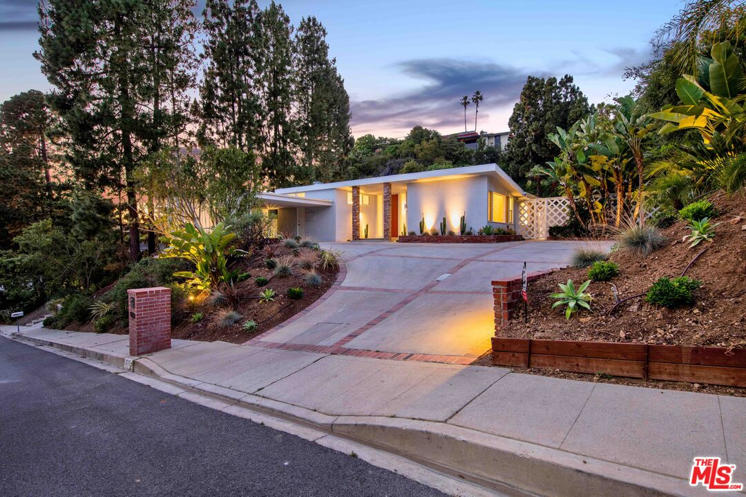 a front view of a house with yard