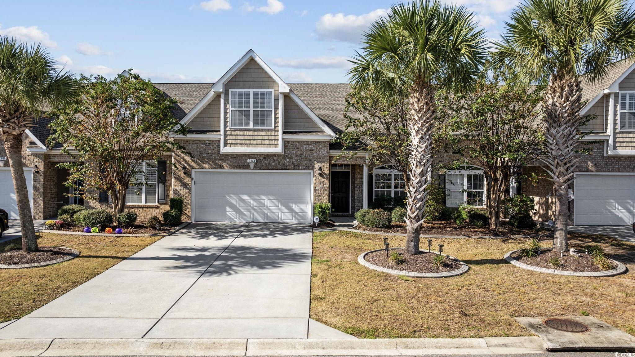 View of front of property featuring a front yard a