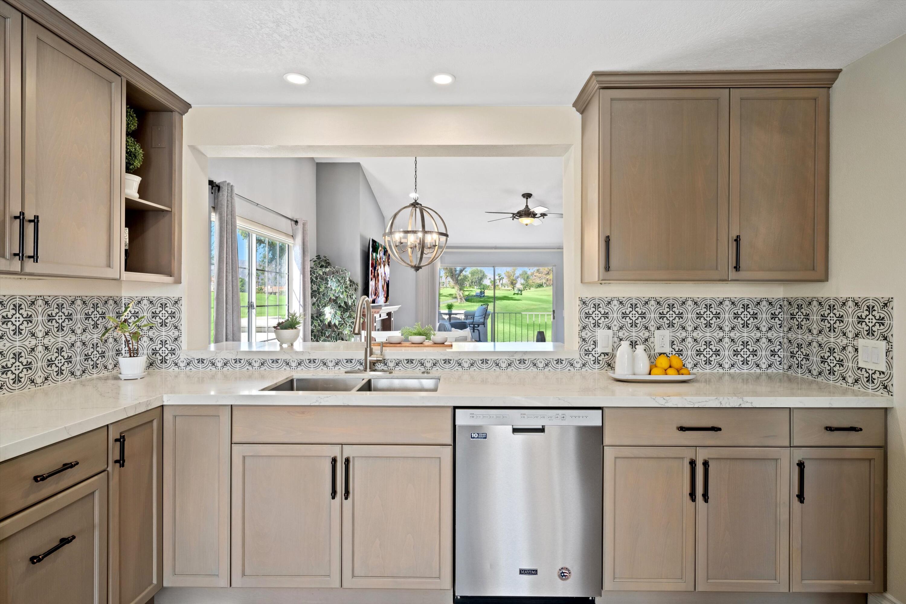 a kitchen with a sink and cabinets