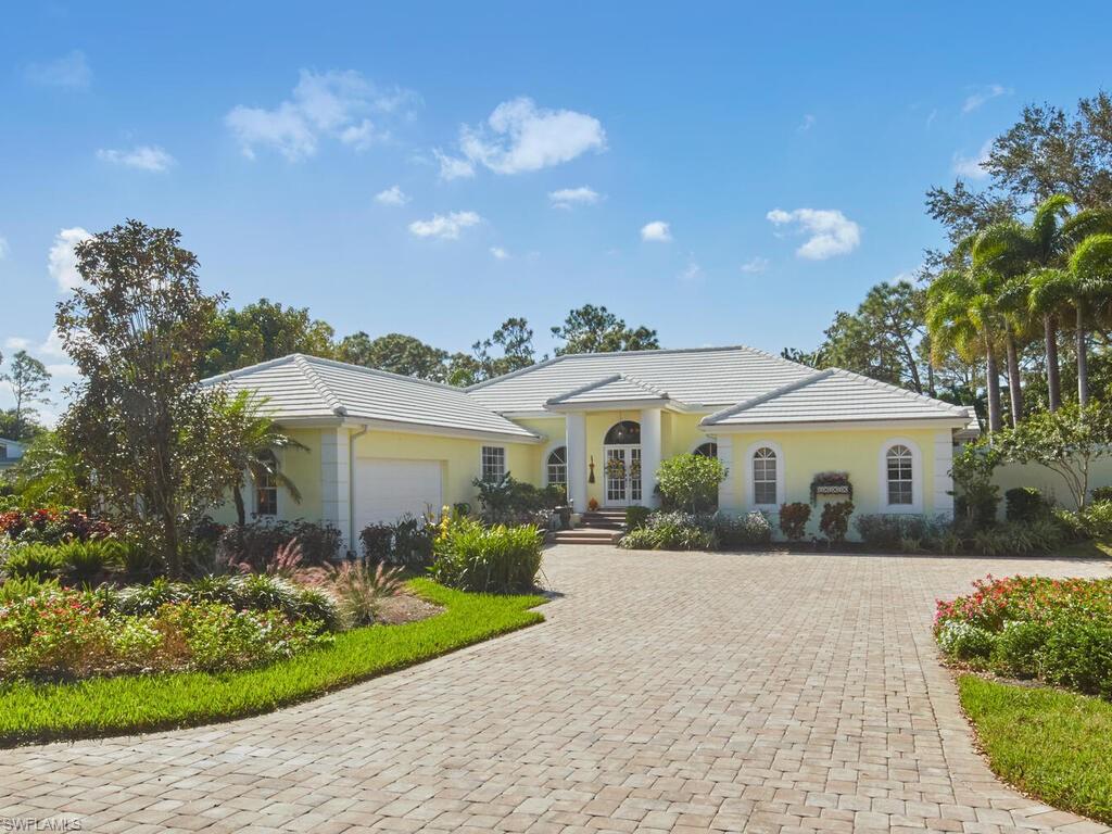 Stately and inviting - you will love living in this beautiful home in Woodlake of Bonita Bay!