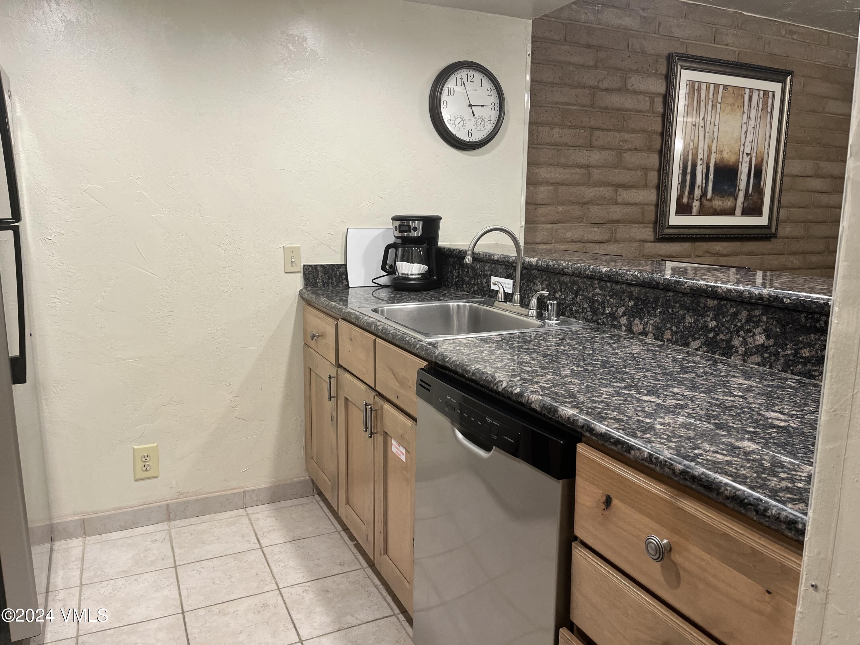 a kitchen with a sink and a stove