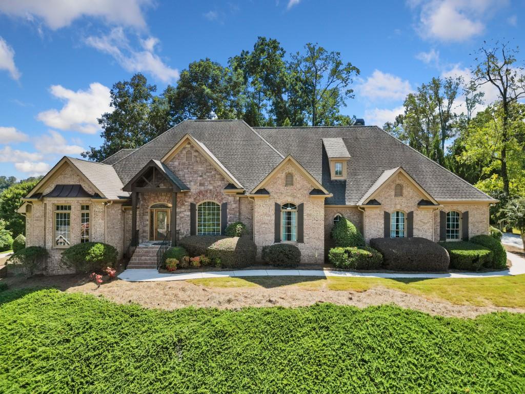 a front view of a house with a yard