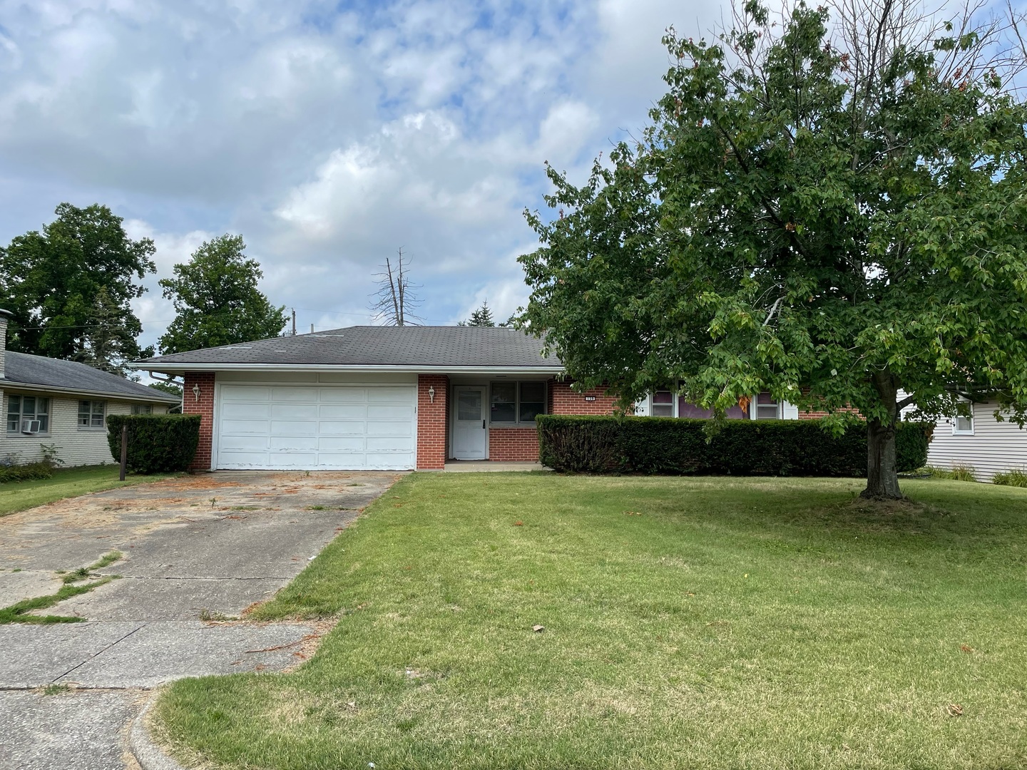 a front view of a house with yard