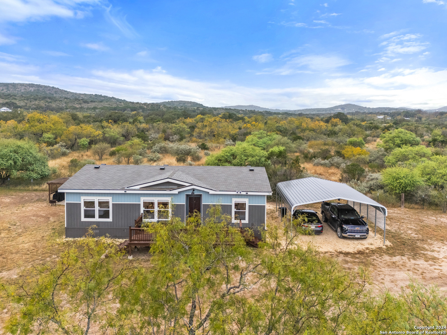 a aerial view of a house with a big yard