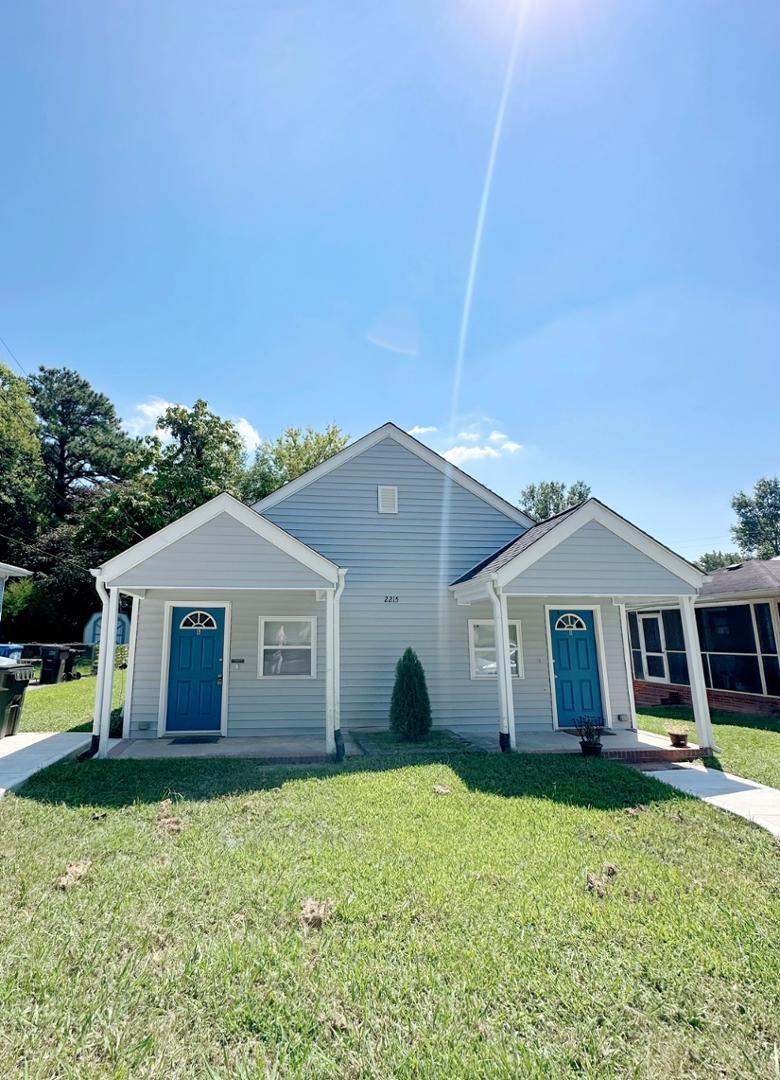 front view of a house with a yard