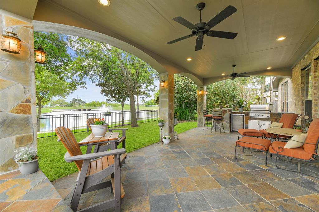 a balcony with furniture and a garden