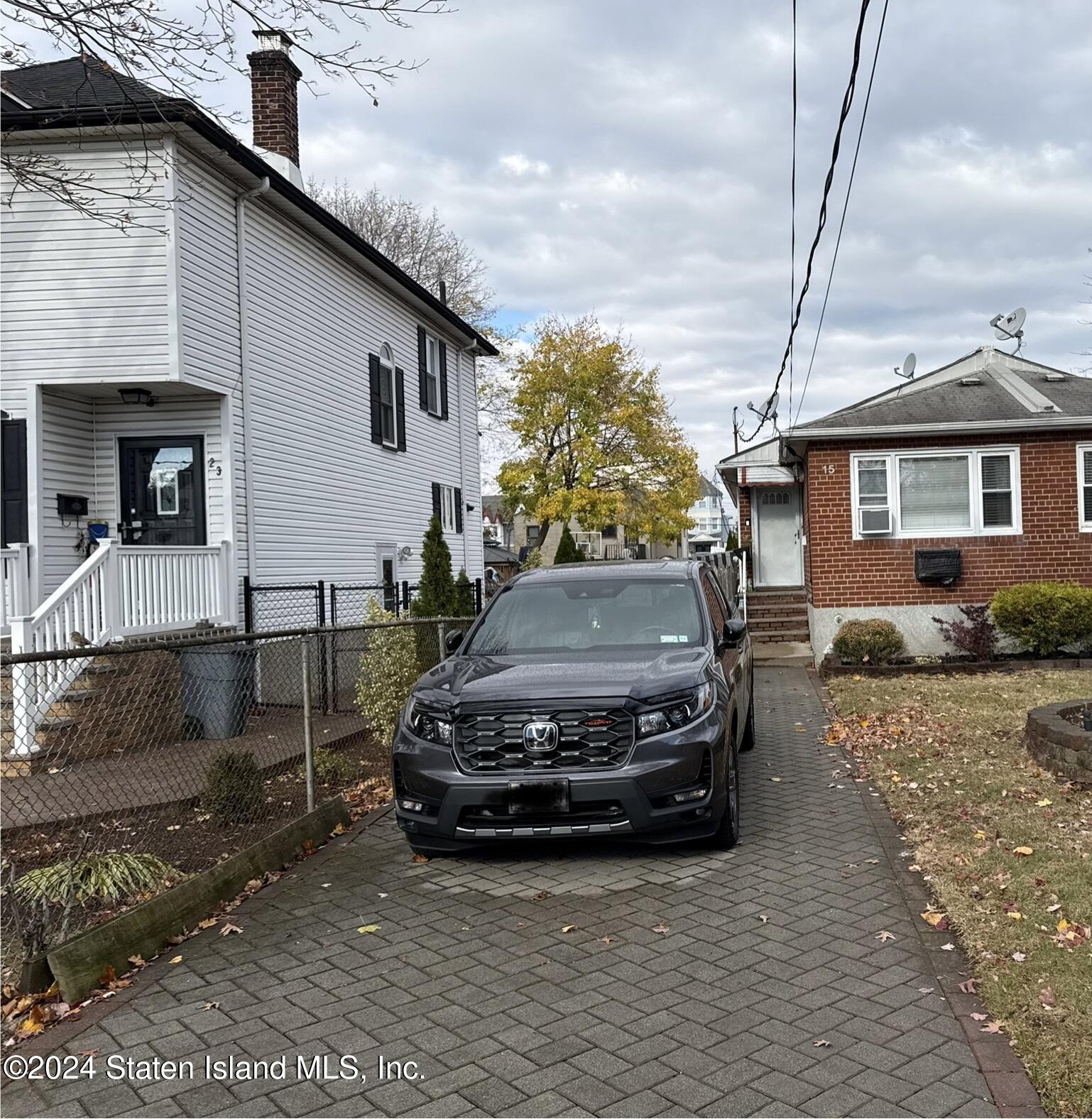 a car parked in front of a house