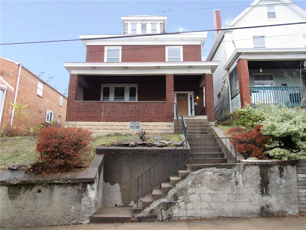 a front view of a house with yard